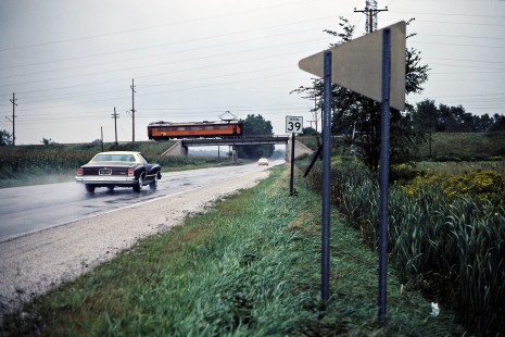 Eastbound South Shore Line passenger train crossing Indiana route 39 at Springville, Indiana, on September 5, 1981.  Photograph by John F. Bjorklund, © 2015, Center for Railroad Photography and Art. Bjorklund-42-13-19
