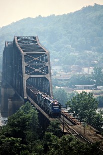 Eastbound Conrail freight train over the Ohio River leaving Steubenville, Ohio, on July 1, 1989. Photograph by John F. Bjorklund, © 2015, Center for Railroad Photography and Art. Bjorklund-30-28-21