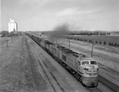 Union Pacific Railroad gas turbine-electric locomotive no. 4 hauls an eastbound freight train  near Sidney, Nebraska, on May 9, 1968. CBQ Bridge visible in background. Photograph by Victor Hand. Hand-UP-64-028.JPG