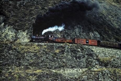 Guayaquil-Quito Railway steam locomotive no. 58 leads passenger train at Nariz del Diablo (Devil's Nose)  near Riobamba, Chimborazo, Ecuador, on July 9, 1990. Photograph by Fred M. Springer, © 2014, Center for Railroad Photography and Art, Springer-ECU1-24-26;