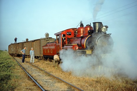 Guayaquil-Quito Railway steam locomotive no. 7 with a freight train and its crew at Casiguana, Guayas, Ecuador, on July 8, 1990. Photograph by Fred M. Springer, © 2014, Center for Railroad Photography and Art, Springer-ECU1-21-31