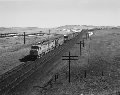 Union Pacific Railroad diesel locomotive no. 6934 leads westbound freight on March 27, 1971 near Granite, Wyoming. Photograph by Victor Hand. Hand-UP-64-228.JPG