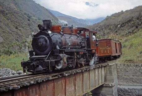 Guayaquil-Quito Railway steam locomotive no. 58 with passenger train crosses a bridge in Huigra, Chimborazo, Ecuador, on July 10, 1990. Photograph by Fred M. Springer, © 2014, Center for Railroad Photography and Art, Springer-SOAM1-02-07