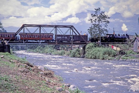 Guayaquil-Quito Railway steam locomotive no. 44 leads passenger train across the Bucay Bridge in Bucay, Chimborazo, Ecuador, on August 2, 1988. Photograph by Fred M. Springer, © 2014, Center for Railroad Photography and Art, Springer-ECU1-19-09
