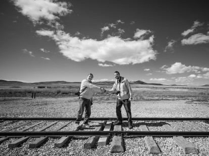 The Center for Railroad Photography & Art's board chair Bon French and executive director Scott Lothes shake hands at the famous meeting point at Promontory at the Golden Spike National Historic Site. Photograph by Eric Baumgartner.