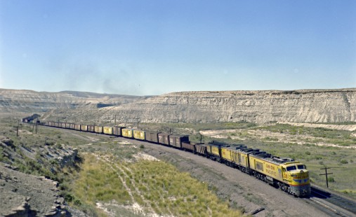 Union Pacific Railroad gas turbine-electric locomotive no. 28 leads eastbound  freight at Green River, Wyoming on August 31, 1968. Photograph by Victor Hand. Hand-UP-C64-18.JPG
