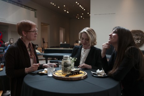 Maureen Muldoon chats with Julie King and Lily Blouin at the exhibition reception on Friday for "After Promontory." Photograph by Hank A. Koshollek.