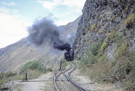 Guayaquil-Quito Railway no. 44 leads passenger train on switchback track from Sibambe, Ecuador to Alausi, Chimborazo, Ecuador, on July 24, 1988. Photograph by Fred M. Springer, © 2014, Center for Railroad Photography and Art, Springer-ECU1-07-08