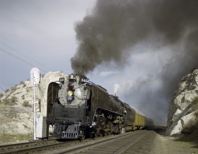 Union Pacific Railroad steam locomotive no. 8444 leads westbound  excursion train between Denver, Colorado, and Rawlins, Wyoming on May 11, 1968. Image shot in Harper, Wyoming. Photograph by Victor Hand. Hand-UP-C64-09.JPG;