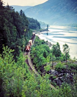 Southbound Canadian Pacific Railway freight train along Kootenary River near Nelson, British Columbia, on July 13, 1983. Photograph by John F. Bjorklund, © 2015, Center for Railroad Photography and Art. Bjorklund-38-07-13