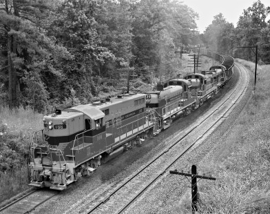 Central of Georgia Railway freight train no. 38 approaches the crossovers at Weems, Alabama, about 15 miles from downtown Birmingham in July 1959. Photograph by J. Parker Lamb, © 2016, Center for Railroad Photography and Art. Lamb-02-011-10