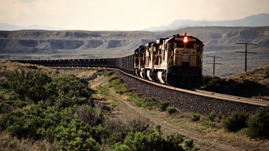 Eastbound empty coal train led by Union Pacific C30-7 no. 2462 on the Denver and Rio Grande Western Railroad at Mounds, Utah, on May 11, 1986. Photograph by John F. Bjorklund, © 2015, Center for Railroad Photography and Art. Bjorklund-48-16-13