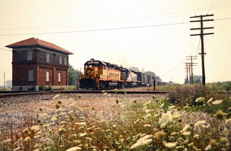 Westbound CSX Transportation freight train passing tower in Hamler, Ohio, on July 30, 1989. Photograph by John F. Bjorklund, © 2015, Center for Railroad Photography and Art. Bjorklund-44-08-18