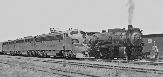 Westbound <i>California Zephyr</i> passes 2-8-2 steam locomotive getting water in Western Pacific Railroad's yard at Sacramento, California, in June 1950. Photograph by J. Parker Lamb, © 2016, Center for Railroad Photography and Art. Lamb-02-022-21