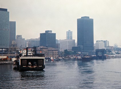 Canadian Pacific Railway cars aboard the <i>Doris Yorke</i> ferry in the harbor with skyline of Vancouver, British Columbia, on August 25, 1971. Photograph by John F. Bjorklund, © 2015, Center for Railroad Photography and Art. Bjorklund-36-08-09
