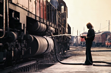 Canadian Pacific Railway worker washing down locomotive at engine house in Windsor, Ontario, on April 20, 1973. Photograph by John F. Bjorklund, © 2015, Center for Railroad Photography and Art. Bjorklund-36-14-24