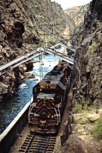 Eastbound Denver and Rio Grande Western Railroad freight train crossing the Hanging Bridge in Colorado's Royal Gorge on September 21, 1986. Photograph by John F. Bjorklund, © 2015, Center for Railroad Photography and Art. Bjorklund-48-20-06