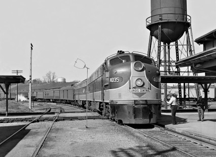 Southbound Illinois Central Railroad <i>Seminole</i> passenger train crosses main line of West Point Route at station in Opelika, Alabama, in August 1955. Absence of interlocker required crew member to flag crossing. Photograph by J. Parker Lamb, © 2016, Center for Railroad Photography and Art. Lamb-02-015-05