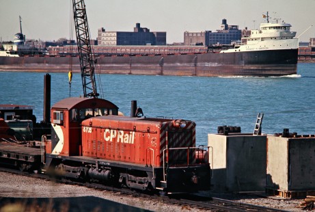 Canadian Pacific Railway at Windsor, Ontario, with downtown Detroit and <i>Ernest R. Breech</i> lake boat in background on October 26, 1974. Photograph by John F. Bjorklund, © 2015, Center for Railroad Photography and Art. Bjorklund-36-25-18