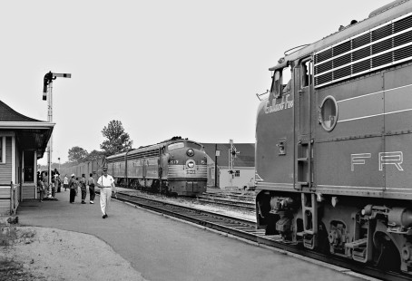 Train time at Winfield, Alabama, where Birmingham-bound <i>Kansas City-Florida Special</i> passenger train (right) meets Memphis-bound counterpart in May 1955. (Note: Frisco's E8s carried names of famous horses; in this case race horse <i>Gallant Fox</i> on right.) Photograph by J. Parker Lamb, © 2016, Center for Railroad Photography and Art. Lamb-02-002-01