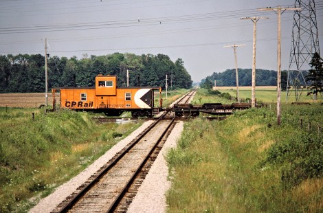 Westbound Canadian Pacific Railway caboose (or van) at Canadian National Railway crossing in Jarvis, Ontario, on July 19, 1986. Photograph by John F. Bjorklund, © 2015, Center for Railroad Photography and Art. Bjorklund-38-25-16