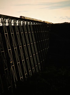 Eastbound Canadian Pacific Railway freight train crossing the Lethbridge Viaduct over Oldman River near Lethbridge, Alberta, on July 10, 1983. Photograph by John F. Bjorklund, © 2015, Center for Railroad Photography and Art. Bjorklund-37-25-18