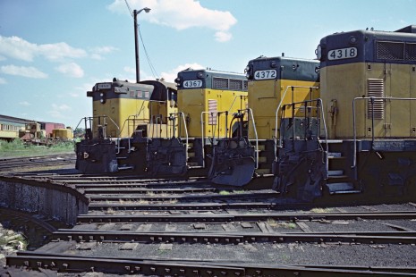 Four Chicago & North Western diesels circle the turntable at Fond du Lac, Wisconsin, on a sunny June day in 1977. Baldwin AS-16 no. 1489 at left joins three GP7s.