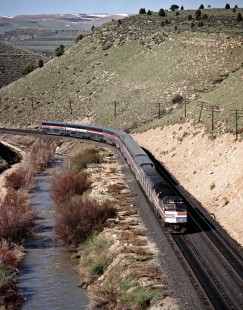 Eastbound Amtrak <i>California Zephyr</i> passenger train descending from Soldier Summit along the Price River on Denver and Rio Grande Western Railroad near Colton, Utah, on May 12, 1982. Photograph by John F. Bjorklund, © 2015, Center for Railroad Photography and Art. Bjorklund-48-17-20