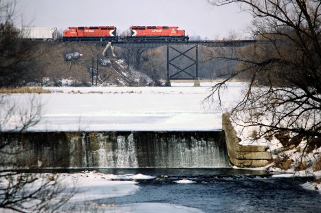 Eastbound Canadian Pacific Railway freight train crossing the Thames River in Thamesford, Ontario, on February 7, 1987. Photograph by John F. Bjorklund, © 2015, Center for Railroad Photography and Art. Bjorklund-39-01-16