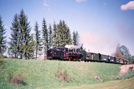 Waldviertler Narrow-Gauge Railway Club 0-8-4T steam locomotive no. 399.04 travels upon a fill in Gerungs, Lower Austria, Austria, on May 13, 2001. Photograph by Fred M. Springer, © 2014, Center for Railroad Photography and Art. Springer-Austria-05-03