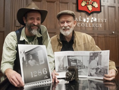 Attendees Oren Helbok and Dennis Livesey pose with photographs taken by their fathers--both were featured in this year's Awards Program. Center for Railroad Photography & Art. Photograph by Henry A. Koshollek.