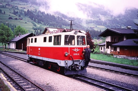 Pinzgauer local train diesel passenger locomotive no. 2095.01 carries a worker on the front in Krimml, Salzburg, Austria, on May 18, 2001. Photograph by Fred M. Springer, © 2014, Center for Railroad Photography and Art. Springer-Austria-12-23