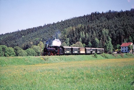 Waldviertler Narrow-Gauge Railway Club 0-8-4T steam locomotive no. 399.04 is surrounded by greenery as it travels near Alt Weitra, Lower Austria, Austria, on May 13, 2001. Photograph by Fred M. Springer, © 2014, Center for Railroad Photography and Art. Springer-Austria-05-37