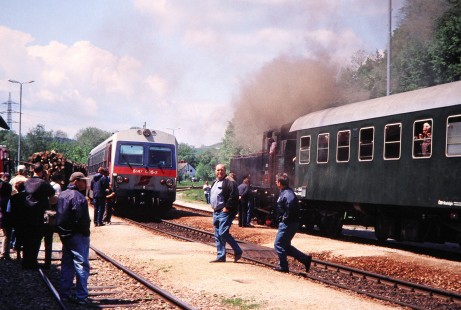 Crowds of people observe Association of Railway Friends (Verband der Eisenbahnfreunde) steam locomotive and an Austrian Federal Railways diesel rail car in Kaumberg, Lower Austria, on May 19, 2001. Photograph by Fred M. Springer, © 2014, Center for Railroad Photography and Art. Springer-Austria-13-09