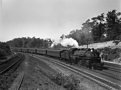 Delaware, Lackawanna and Western Railroad 4-6-2 steam locomotive no. 1114 leads eastbound passenger train near Lake Hopatcong, New Jersey, on August 24, 1940. Photograph by Donald Furler; Furler-03-015-04.JPG; © 2017, Center for Railroad Photography and Art