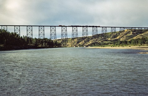 Eastbound Canadian Pacific Railway freight train crossing the Lethbridge Viaduct over Oldman River at Lethbridge, Alberta, on July 11, 1983. Photograph by John F. Bjorklund, © 2015, Center for Railroad Photography and Art. Bjorklund-38-01-22