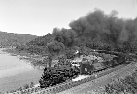 Erie Railroad 4-6-2 steam locomotive no. 2748 leading a westbound passenger train along the Delaware River in Shohola, Pennsylvania, across the river from Pond Eddy, New York, on September 23, 1947. Photograph by Donald W. Furler, © 2017, Center for Railroad Photography and Art, Furler-20-019-02