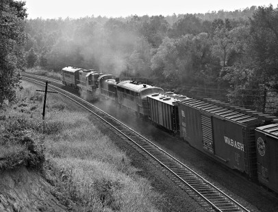 Central of Georgia Railway freight train no. 38 fights a stiff grade surrounded by clouds from heavy sanding and wide-open throttles in July 1959. Photograph by J. Parker Lamb, © 2016, Center for Railroad Photography and Art. Lamb-02-012-02