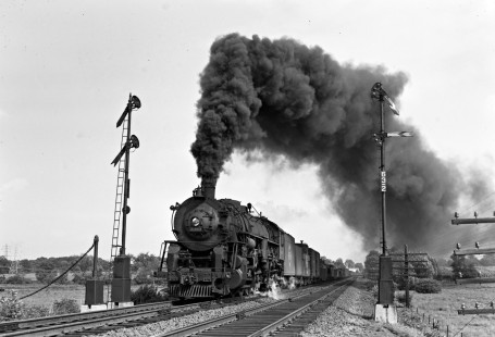 Erie Railroad 2-8-4 steam locomotive no. 3363 pulling westbound freight train no. 83 with 80 cars past semaphore signals at New Hampton, New York, on August 5, 1950. Photograph by Donald W. Furler, © 2017, Center for Railroad Photography and Art, Furler-11-031-01