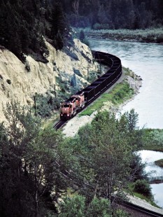 Westbound Canadian Pacific Railway freight train along Kootenay River at Fort Steele, British Columbia, on July 12, 1983. Photograph by John F. Bjorklund, © 2015, Center for Railroad Photography and Art. Bjorklund-38-04-04