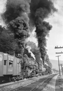 Baltimore and Ohio Railroad  2-10-2 steam locomotives no. 6135 and no. 6145 push a westbound freight train near Hyndman, Pennsylvania, on August 6, 1953. Photograph by Donald W. Furler. Furler-13-120-01.; © 2017, Center for Railroad Photography and Art