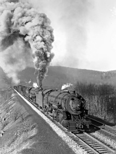 Delaware, Lackawanna, and Western Railroad 2-8-2 steam locomotive no. 2121 and 4-8-4  no. 1619 lead eastbound freight train emerging from cut-off tunnel (Roseville Tunnel) near Andover, New Jersey, on December 6, 1941. Photograph by Donald Furler.; Furler-11-121-01.JPG; © 2017, Center for Railroad Photography and Art