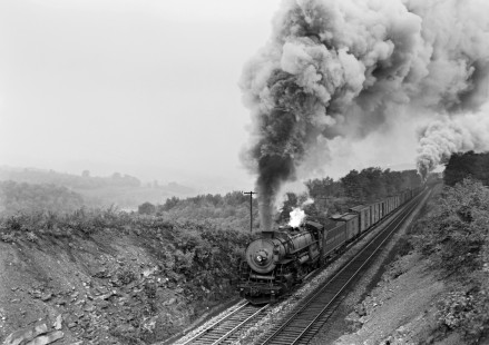 Western Maryland Railway steam locomotive no. 1124 leads a westbound freight train midway between Mt. Savage and Frostburg, Maryland on October 11, 1952. Furler-16-005-02; © 2017, Center for Railroad Photography and Art
