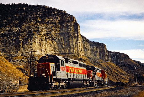 Western Utah Railway coal train on the Southern Pacific's former Denver and Rio Grande Western Railroad at Castle Gate, Utah, on December 28, 1995. Rio Grande acquired the much bigger SP in 1988, but retain the name of the larger road. Union Pacific purchased the entire system in 1996. Photograph by John F. Bjorklund, © 2015, Center for Railroad Photography and Art. Bjorklund-49-18-10
