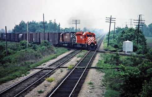 Westbound Canadian Pacific Railway freight train crossing Canadian National Railway near Chatham, Ontario, on May 30, 1982. Photograph by John F. Bjorklund, © 2015, Center for Railroad Photography and Art. Bjorklund-37-18-19