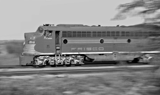 Westbound Frisco Lines <i>Kansas City-Florida Special</i> passenger train races along main line west of Amory, Mississippi, in late afternoon of August 1958. (Note: Frisco's E8s were named for famous horses, such as race horse <i>Ponder</i>.) Photograph by J. Parker Lamb, © 2016, Center for Railroad Photography and Art. Lamb-02-002-05