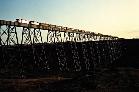 Eastbound Canadian Pacific Railway freight train crossing Lethbridge Viaduct over Oldman River near Lethbridge, Alberta, on July 10, 1983. Photograph by John F. Bjorklund, © 2015, Center for Railroad Photography and Art. Bjorklund-37-25-15