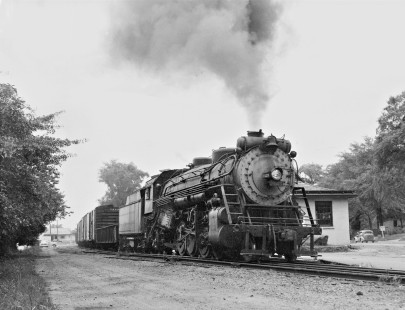Eastbound West Point Route freight heads past station at Auburn, Alabama, behind 2-8-2 steam locomotive no. 425 in July 1952. Photograph by J. Parker Lamb, © 2016, Center for Railroad Photography and Art. Lamb-02-018-03