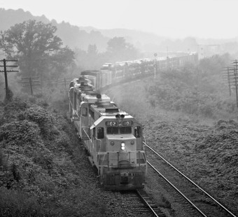 Atlanta-bound Louisville and Nashville Railroad automobile train crawls through a light mist as it uses Southern Railway double-track line from L&N's yard in Wauhatchie, Tennessee, to downtown Chattanooga in August 1963. Photograph by J. Parker Lamb, © 2016, Center for Railroad Photography and Art. Lamb-01-149-05