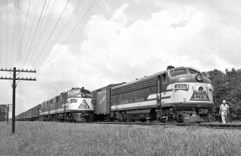 Mobile-bound Louisville and Nashville Railroad passenger extra (troop movement) slides past local freight train between Gulfport and Biloxi, Mississippi, in August 1958. Photograph by J. Parker Lamb, © 2016, Center for Railroad Photography and Art. Lamb-01-138-10